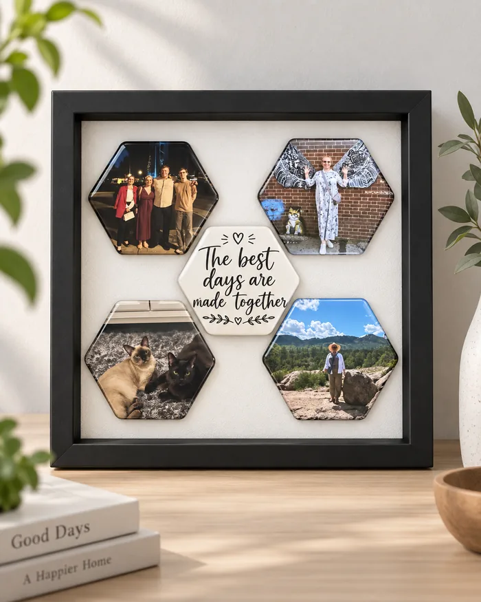 Four photo magnets around a cream phrase magnet, presented in a black display box